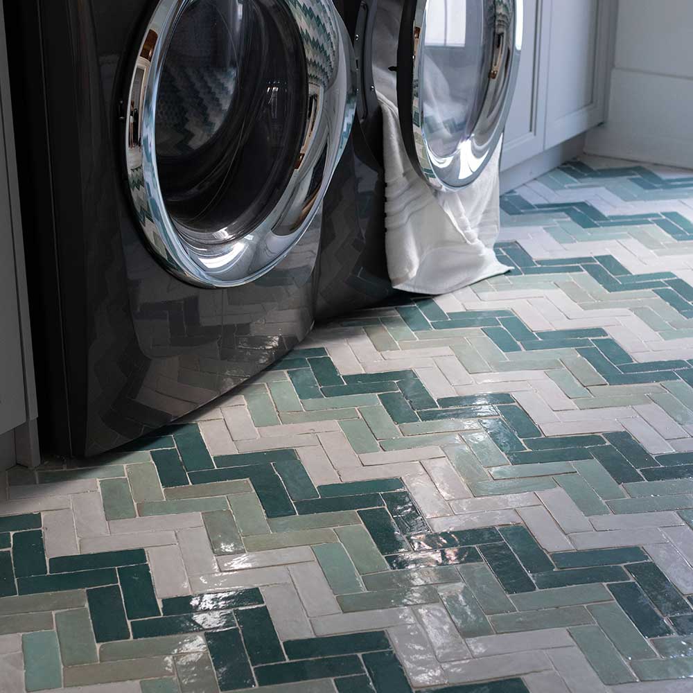 Laundry room floor, with zellige tile layer in herringbone patters. Three colors featured, Silk (soft white), Green Tea (soft green) Peacock (deep aqua)